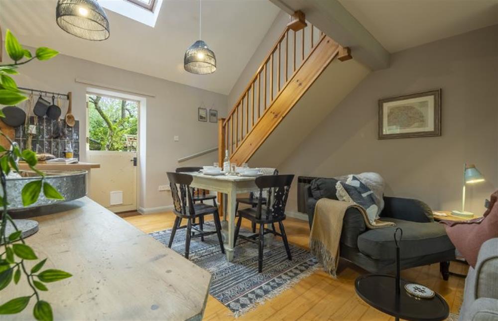 Ground floor: Dining area with stairs   at Garden Wall Cottage, Great Snoring near Fakenham