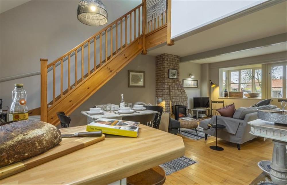 Ground floor: From kitchen, looking in to sitting room and stairs to the first floor at Garden Wall Cottage, Great Snoring near Fakenham