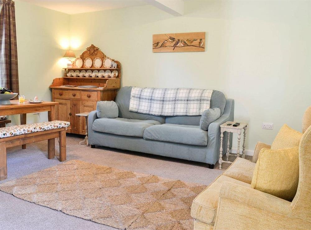 Living room/dining room at Gardeners Cottage in Castle Douglas, Kirkcudbrightshire