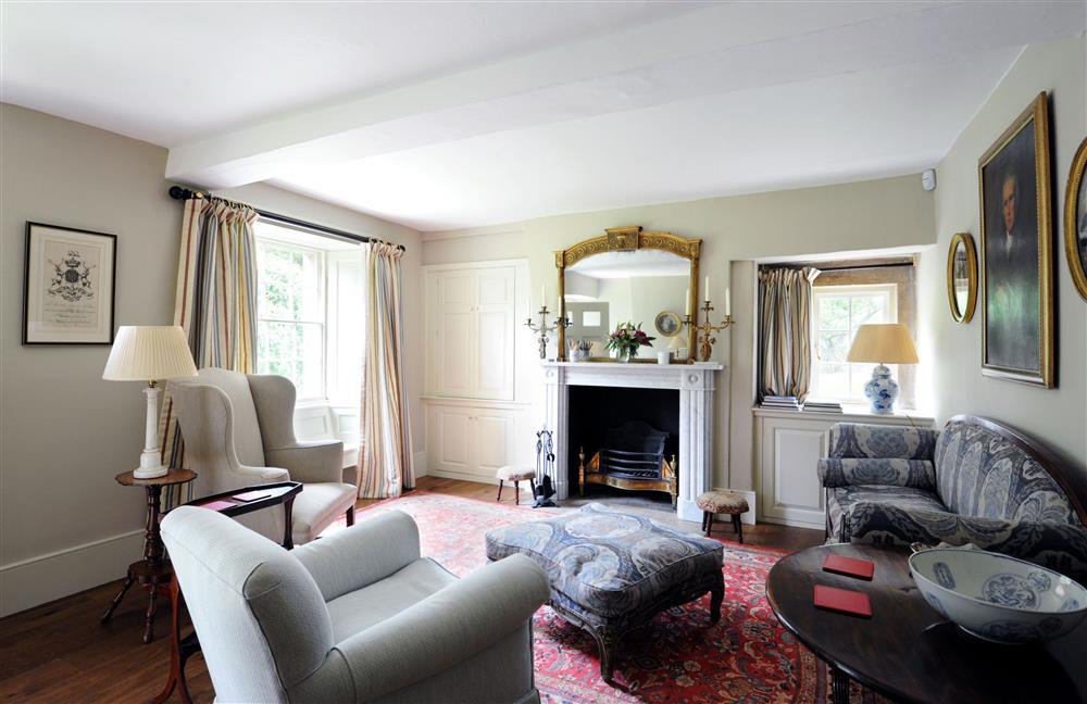 The cosy sitting room with open-fire at Gardeners Cottage, Chatsworth Estate, Edensor, Nr Bakewell