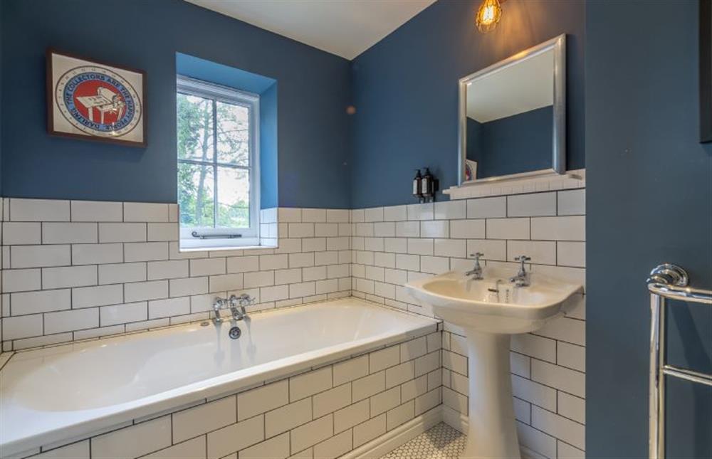 First floor: Bathroom with double ended bath, wash basin and WC at Gardeners Cottage, Fring near Kings Lynn
