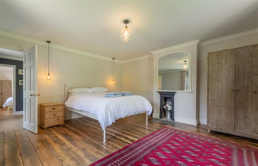 First floor: Bedroom three with wardrobe and feature mirror at Gardeners Cottage, Fring near Kings Lynn