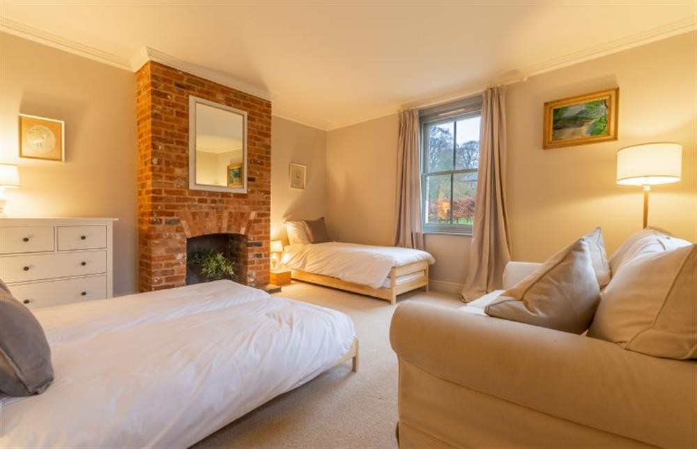 Ground floor: Bedroom three has feature fireplace (photo 2) at Gardeners Cottage, Fring near Kings Lynn