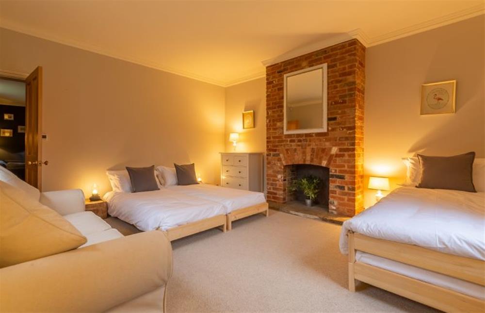 Ground floor: Bedroom three has feature fireplace at Gardeners Cottage, Fring near Kings Lynn