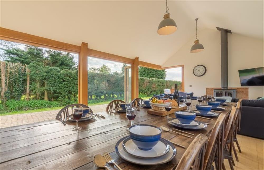 Ground floor: Open-plan dining/family room with table and seating for ten at Gardeners Cottage, Fring near Kings Lynn