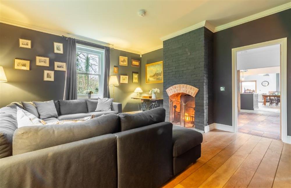 Ground floor: Snug with feature open fire at Gardeners Cottage, Fring near Kings Lynn
