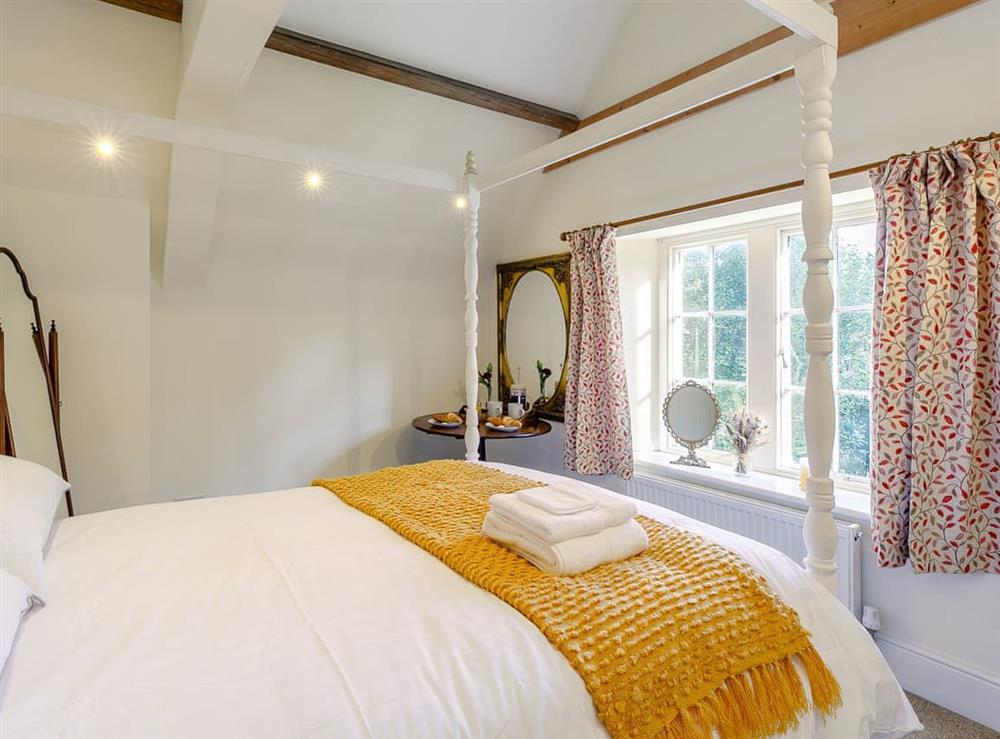 Four Poster bedroom at Gardeners Cottage in Leadenham, Lincolnshire