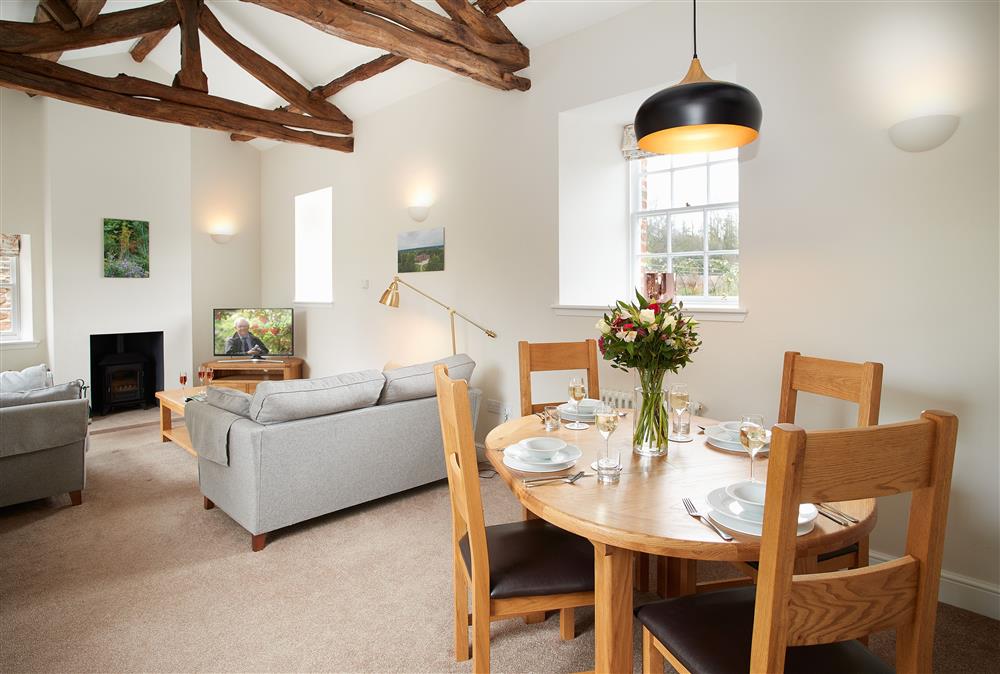 Dining area with seating for four guests at Gardeners Cottage, Netherby Hall, Longtown