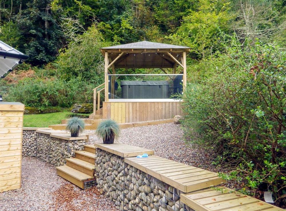 Hot tub in the garden at Gardeners Cottage in Onich, near Fort William, Inverness-Shire