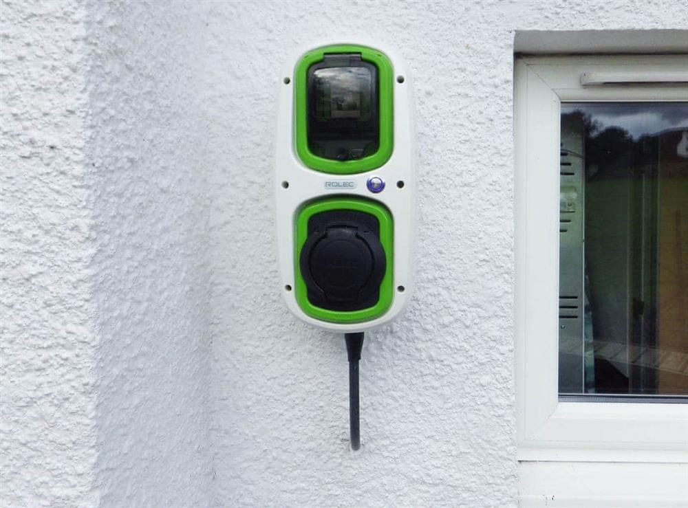 Wall-mounted electric car charger at Gardeners Cottage in Onich, near Fort William, Inverness-Shire