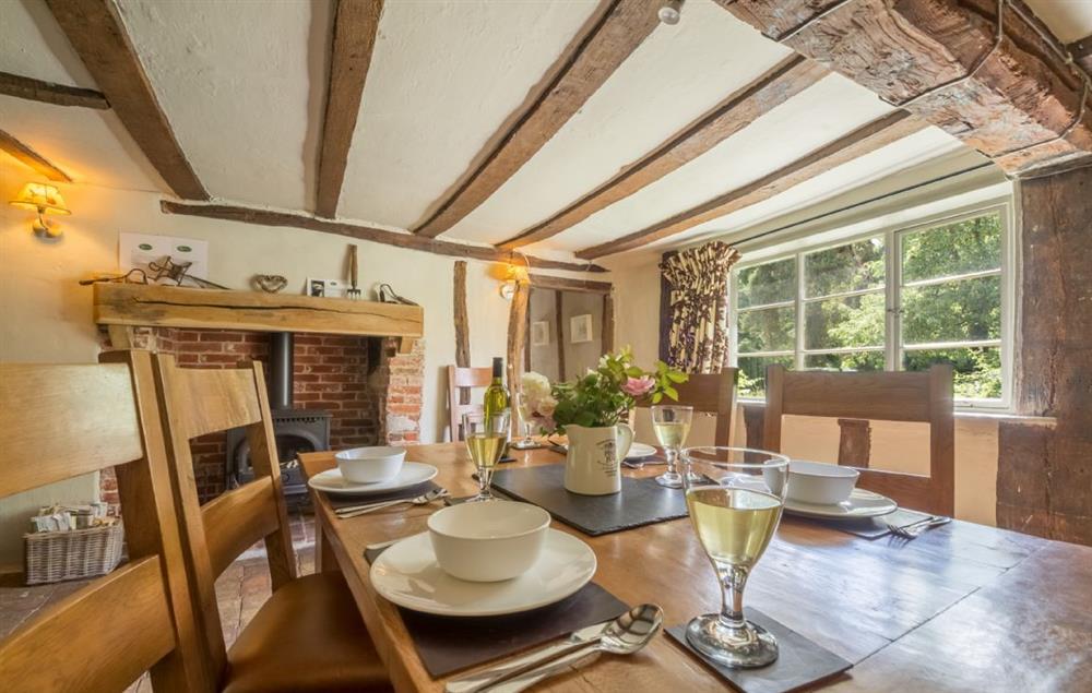 Dining room with an inglenook and wood burning stove (photo 2) at Gardeners Cottage (Suffolk), Thornham Magna