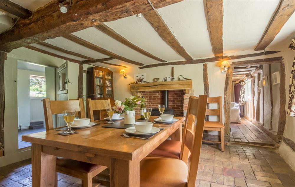 Dining room with an inglenook and wood burning stove at Gardeners Cottage (Suffolk), Thornham Magna