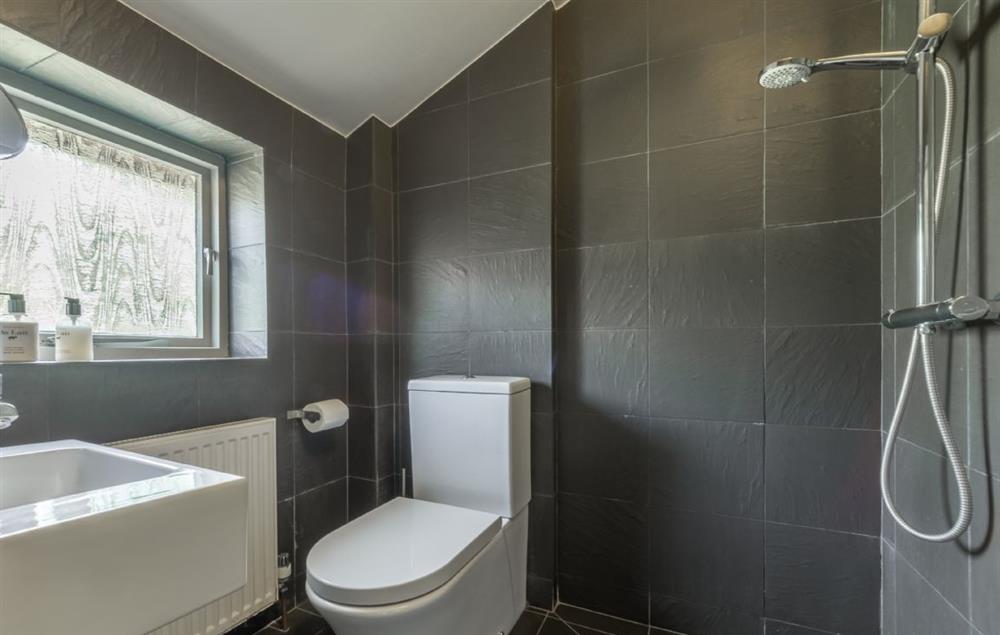 Wet room accessed from the utility boot room with a shower wc and basin at Gardeners Cottage (Suffolk), Thornham Magna
