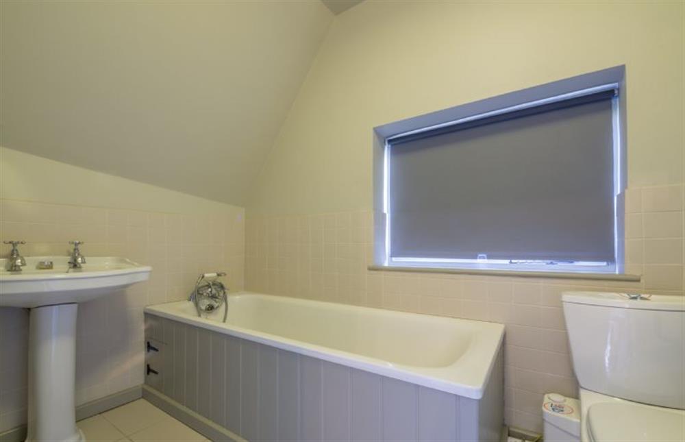 First floor: Bathroom with bath with hand held shower at Gardeners Cottage, Thornham Magna near Eye