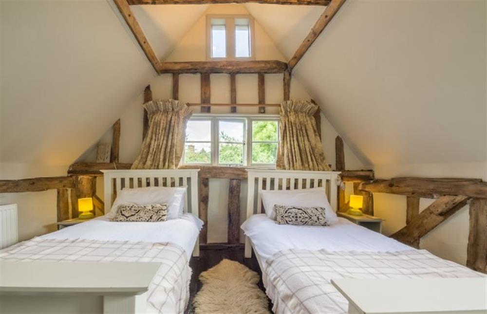 First floor:  Twin bedroom with vaulted, beamed ceiling at Gardeners Cottage, Thornham Magna near Eye