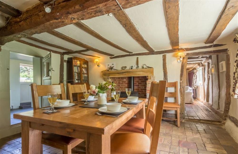 Ground floor: Dining table seating four with feature beams at Gardeners Cottage, Thornham Magna near Eye