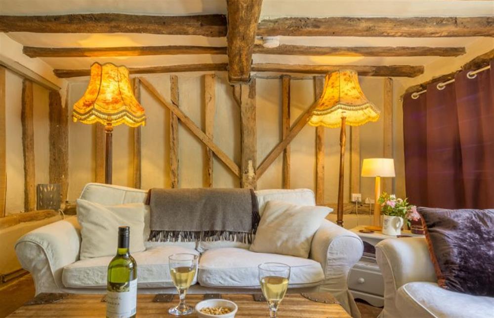 Ground floor: Seating area with feature beams at Gardeners Cottage, Thornham Magna near Eye