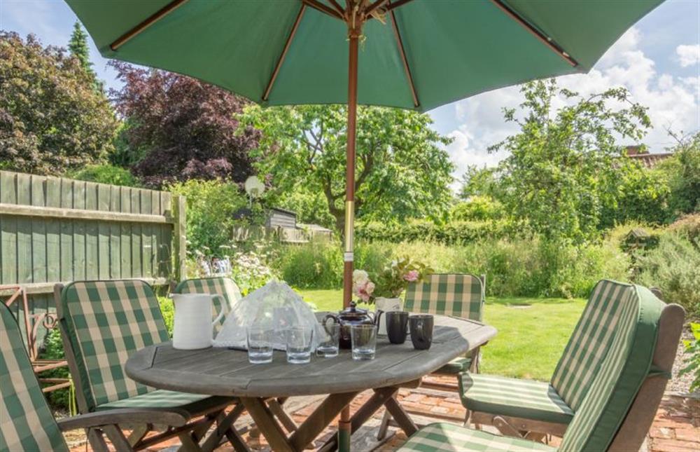 Outdoor dining table with seating for six to the rear of the property at Gardeners Cottage, Thornham Magna near Eye