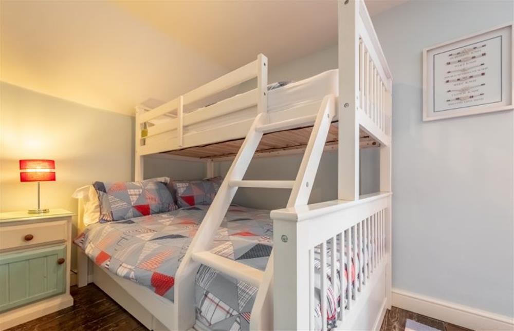 Bedroom three with a single full length bunk on the top of this multi-sleeper with ladder and double bed beneath (photo 2)
