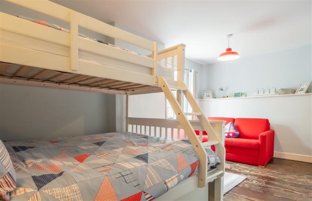 Bedroom three with a single full length bunk on the top of this multi-sleeper with ladder and double bed beneath (photo 3)
