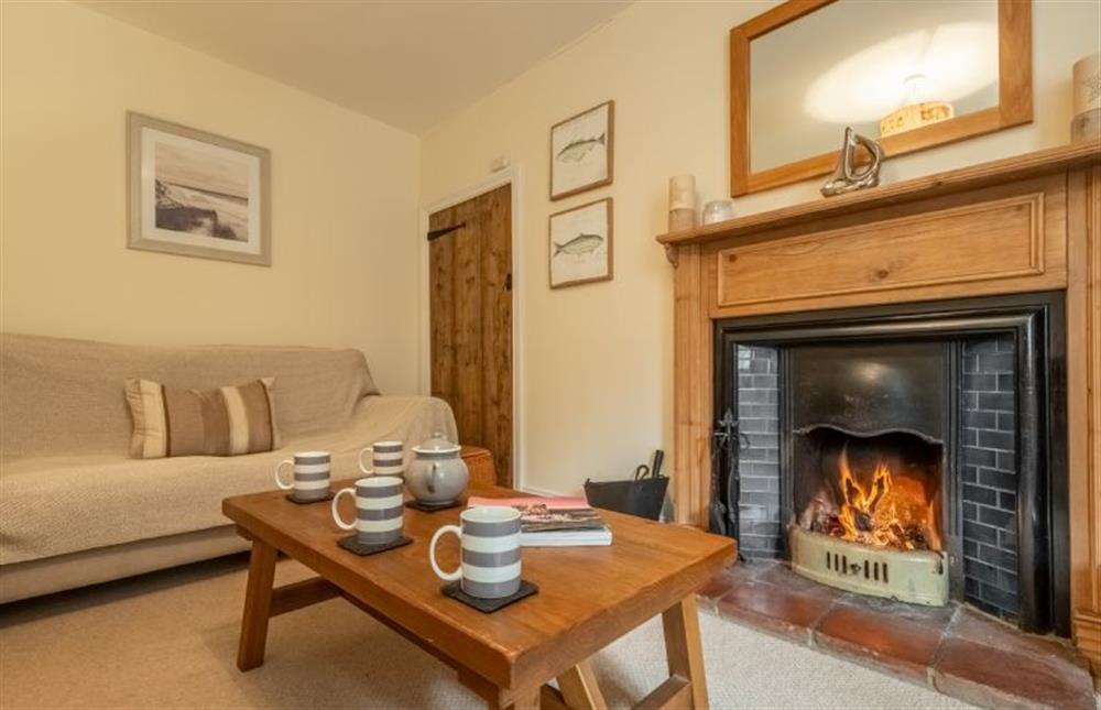 Cosy sitting room with an open fire (photo 2) at Gardeners Cottage, Thornham near Hunstanton