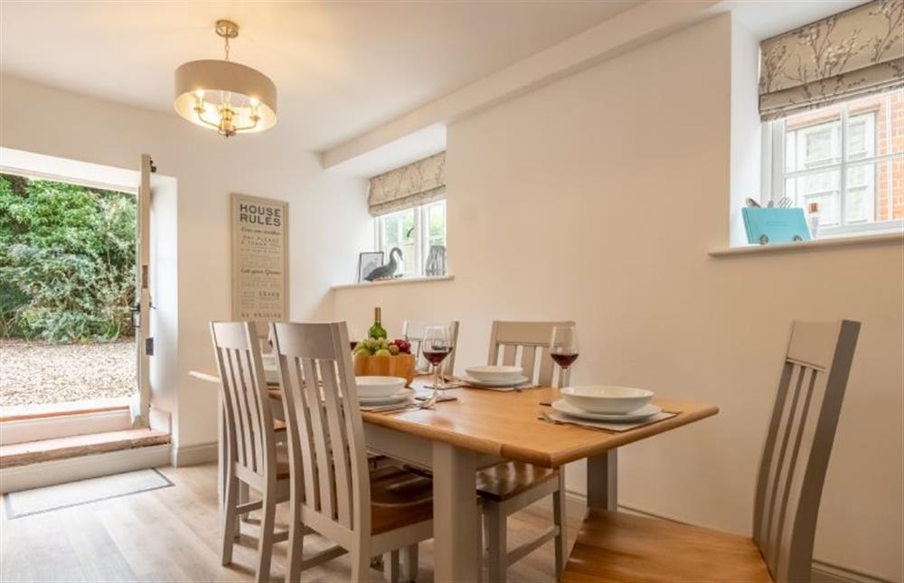 Open plan Dining area with seating for six people (photo 4) at Gardeners Cottage, Thornham near Hunstanton