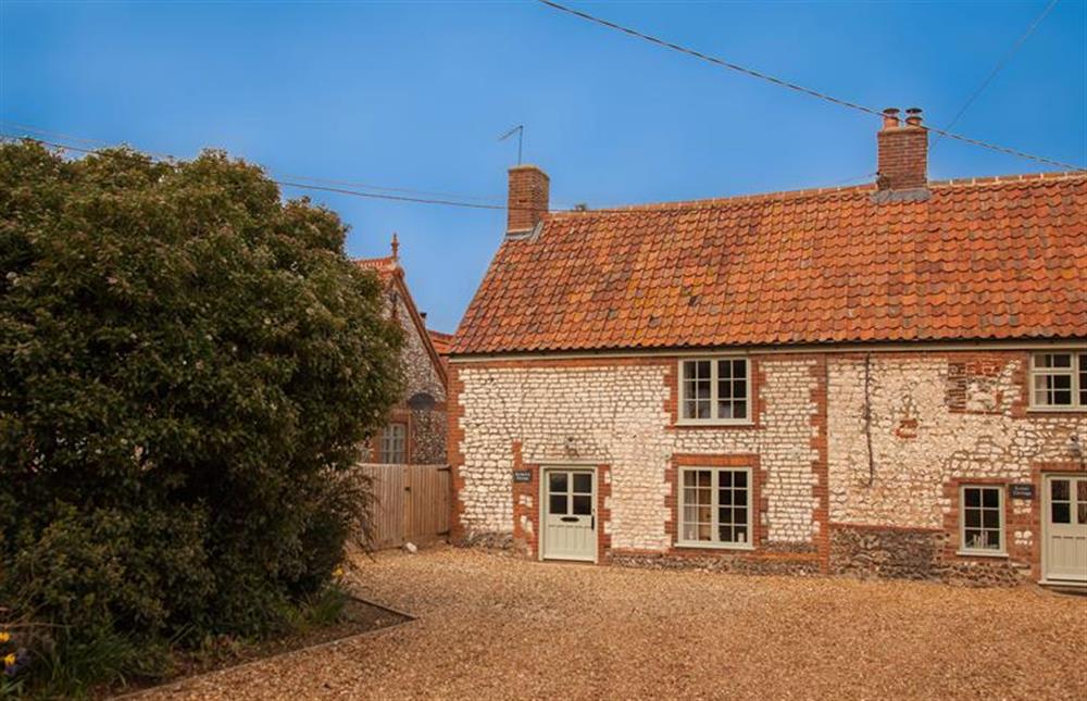 The front of the property with space for parking on the shared driveway at Gardeners Cottage, Thornham near Hunstanton