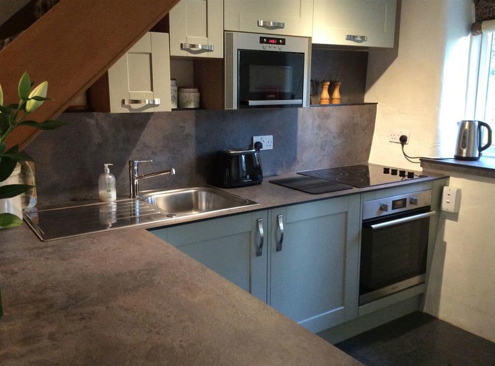 Compact kitchen at Garries Cottage in Keswick, Cumbria