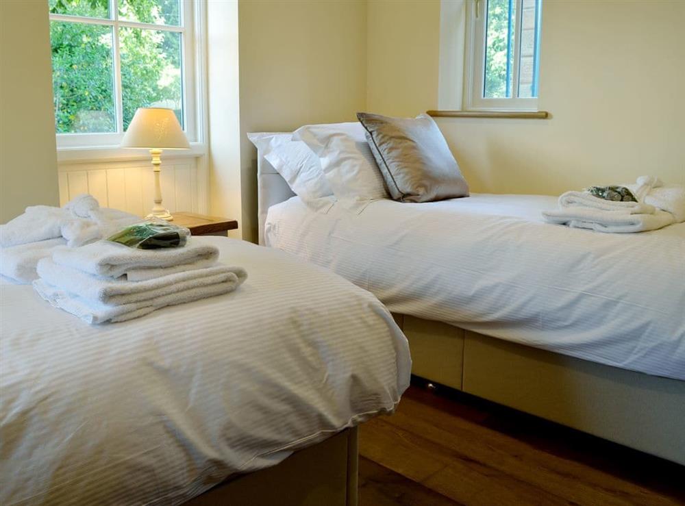 Charming twin bedroom (photo 2) at Garth Cottage, 