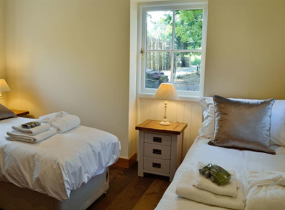 Charming twin bedroom at Garth Cottage, 