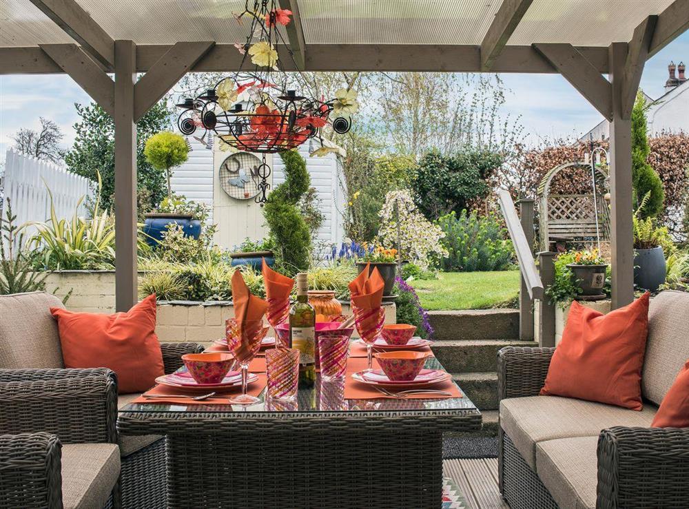 Relaxing summer dining area in a covered veranda at Garth View in Bolton, near Appleby, Cumbria, England