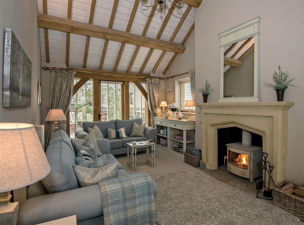 Warm and welcoming living room with beams at Garth View in Bolton, near Appleby, Cumbria, England