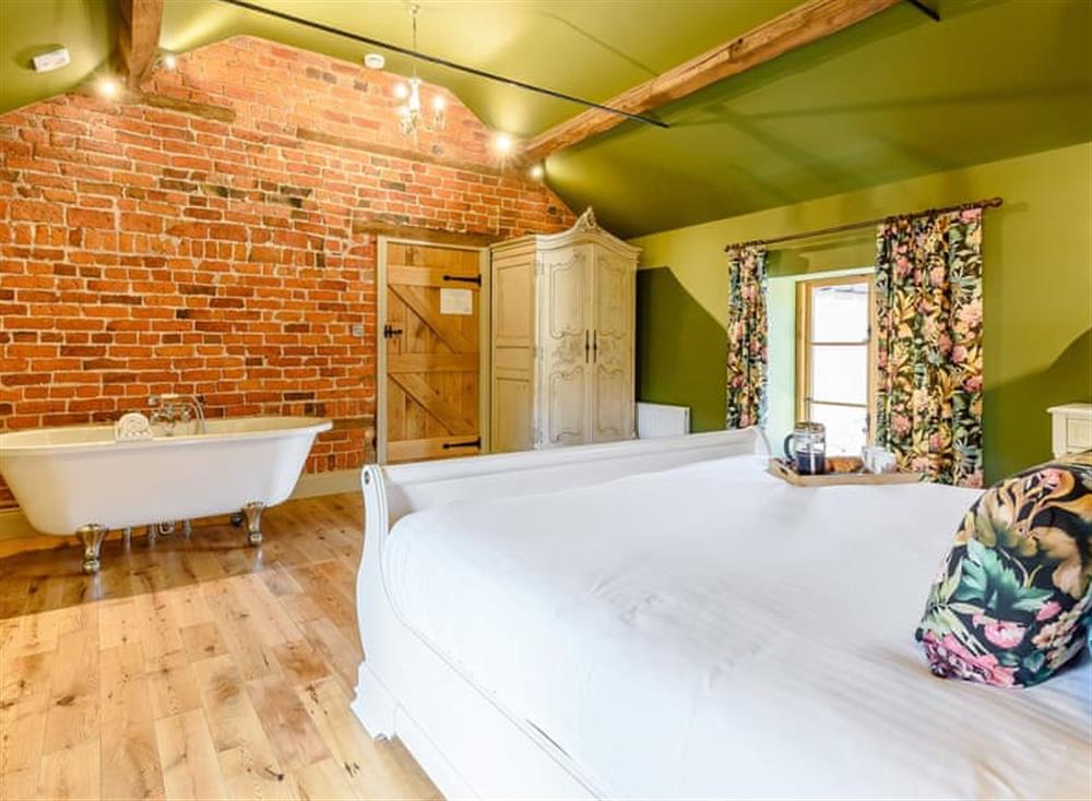 Delightful double bedroom with roll top bath (photo 2) at The Clock Tower, 