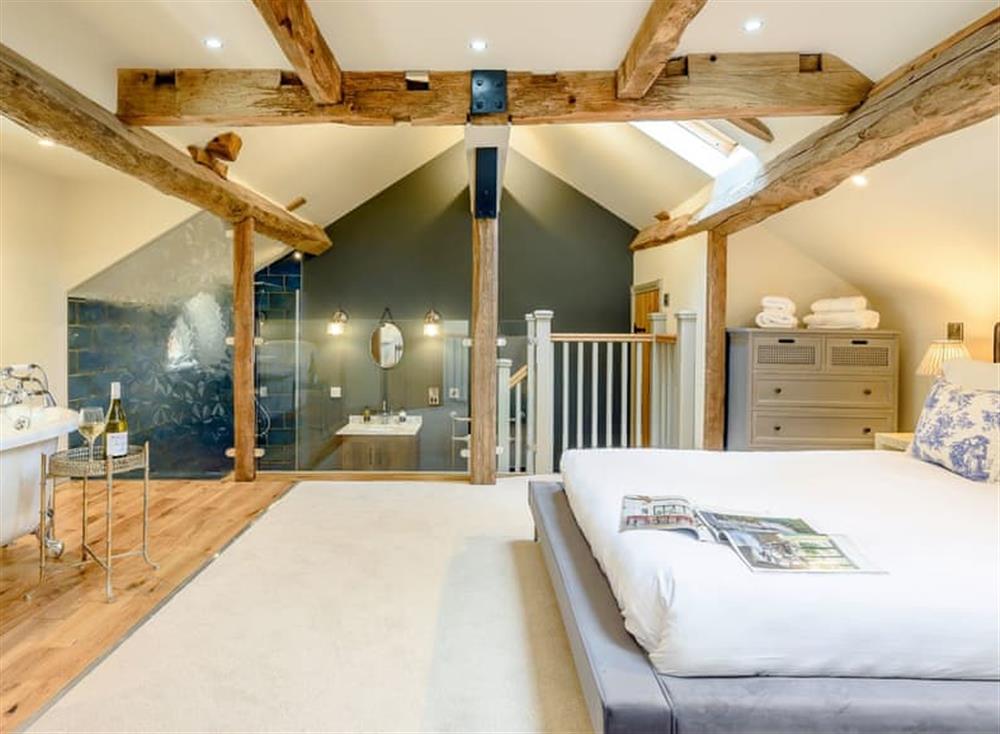 Stunning bedroom with roll top bath and walk in shower area at The Clock Tower, 