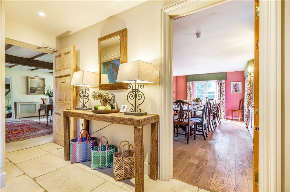 Traditional furnishings and a piano beam character through the sitting room