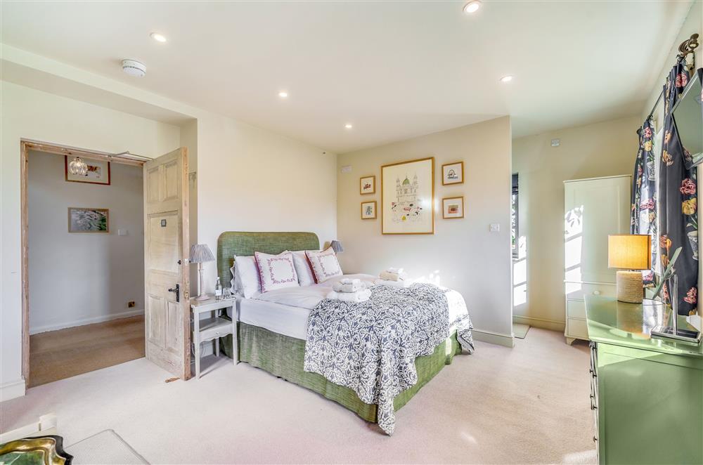 Bedroom two - The Garden Room with a 5’ king-size bed at Gate Street Farm House, Bramley, Guildford