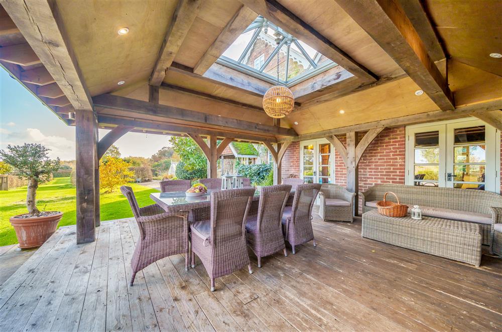 The garden, with a choice of sheltered or open-air alfresco dining at Gate Street Farm House, Bramley, Guildford