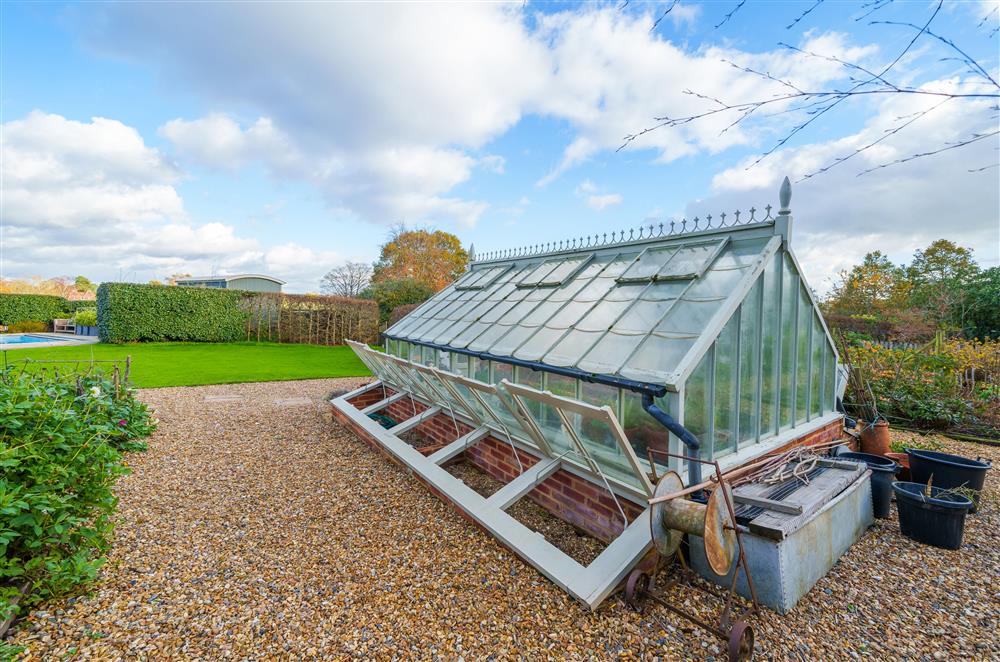The green house and gardens at Gate Street Farmhouse at Gate Street Farm House, Bramley, Guildford