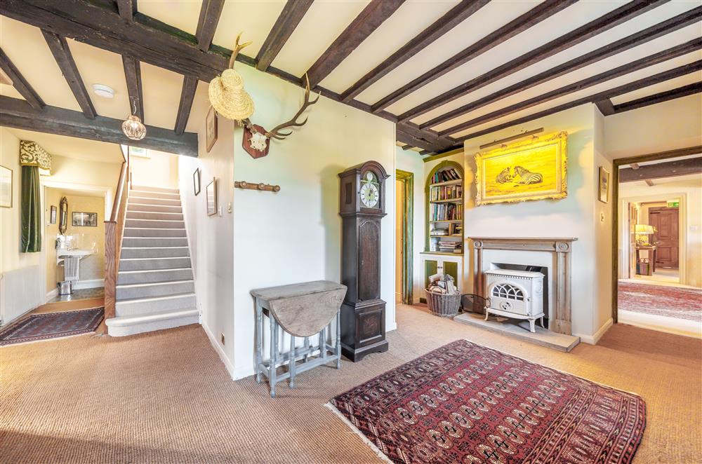 The ground floor hallway with original beams and a wood burning stove (photo 2) at Gate Street Farm House, Bramley, Guildford