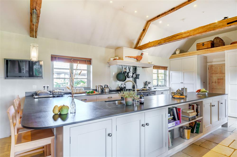 The stylish kitchen with a breakfast bar (photo 2) at Gate Street Farm House, Bramley, Guildford