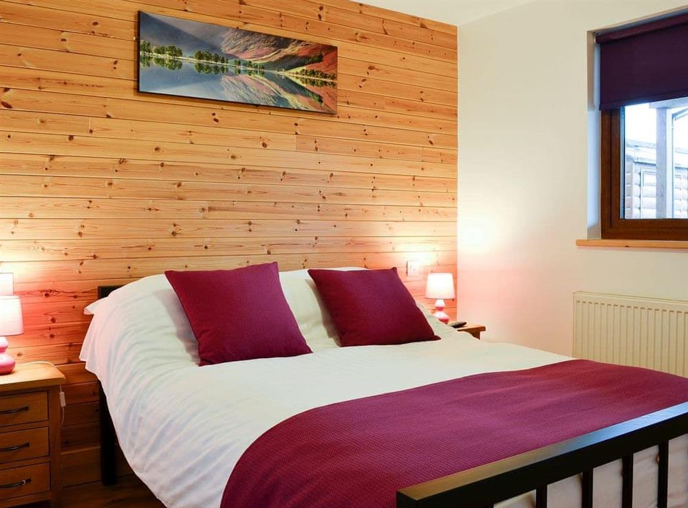 Warm and inviting double bedroom at Blake Fell Lodge, 