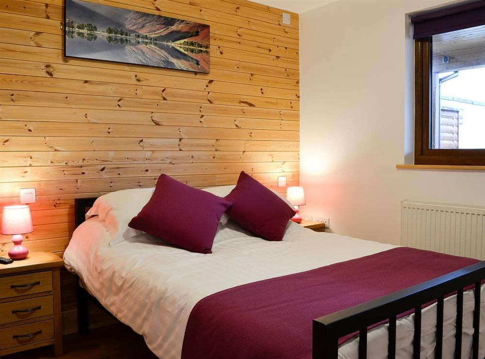 Bedroom with cosy double bed at Knock Murton Lodge, 
