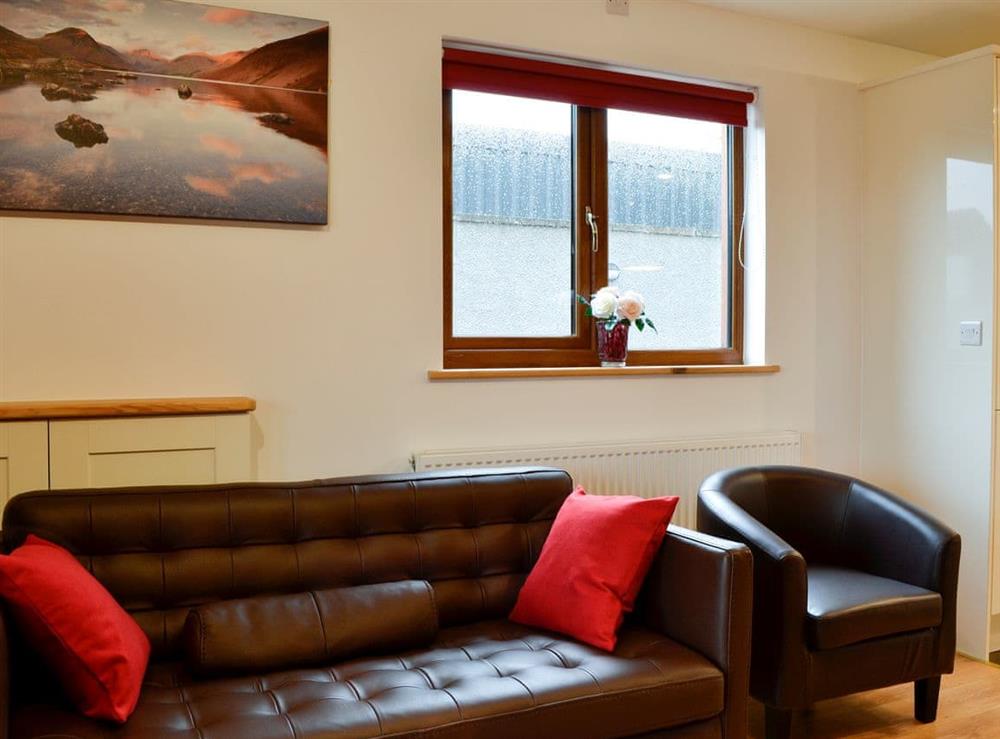 Comfortable leather furniture at Knock Murton Lodge, 