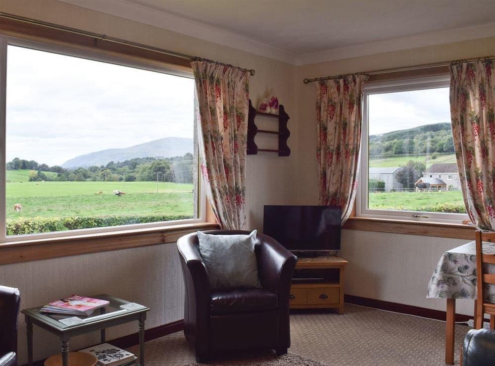 Living room with wonderful views at Gean Cottage in Rumbling Bridge, near Kinross, Kinross-Shire