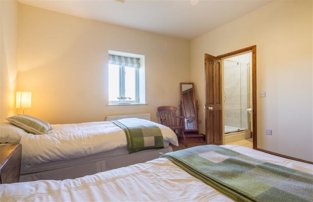 Ground floor: Bedroom three, twin with en-suite shower room at Geddings Farm Barn, Ringstead near Hunstanton