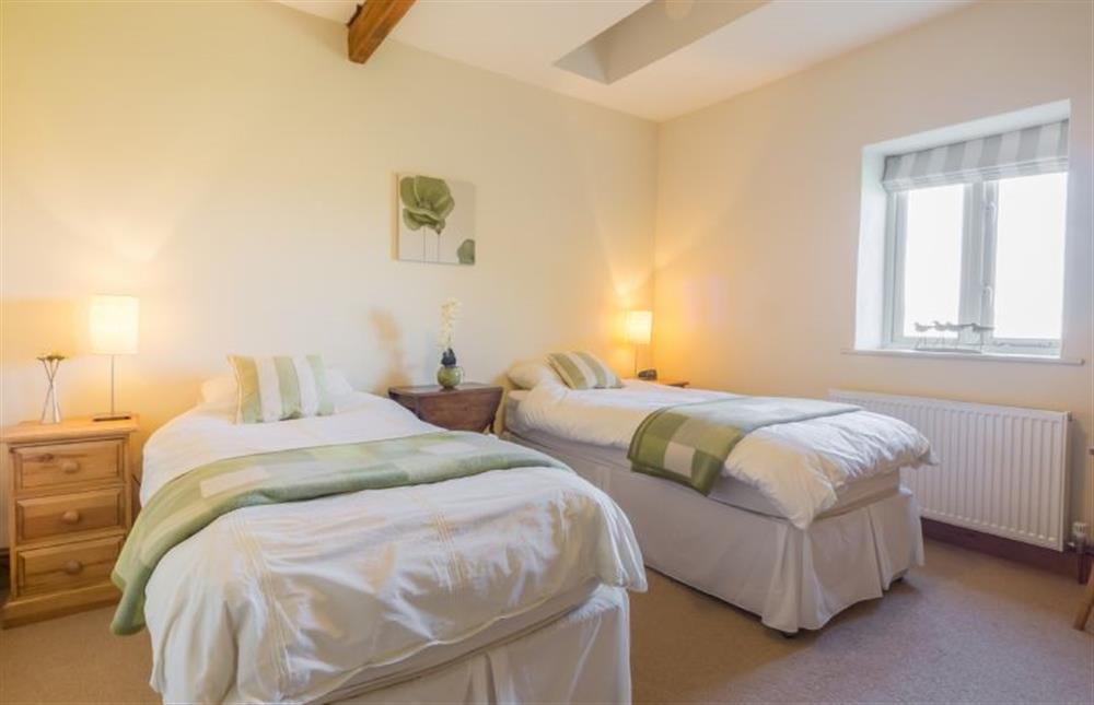 Ground floor: Bedroom two, twin with en-suite shower room at Geddings Farm Barn, Ringstead near Hunstanton
