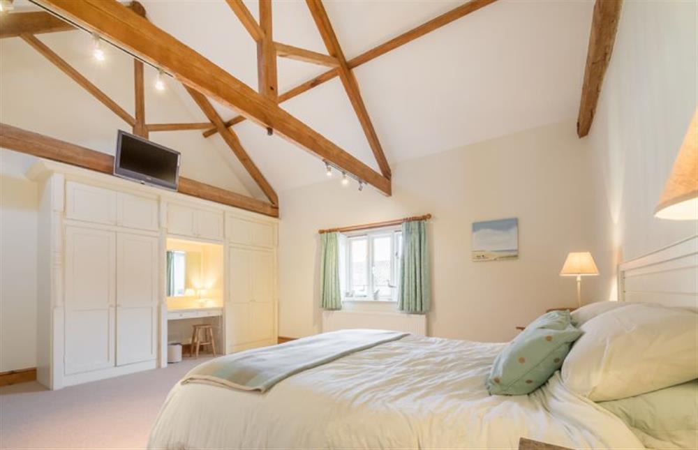 Ground floor: very spacious Master bedroom has king-size bed at Geddings Farm Barn, Ringstead near Hunstanton