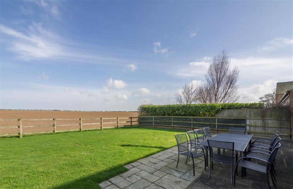 The garden is fully enclosed, and looks out onto open farmland at Geddings Farm Barn, Ringstead near Hunstanton