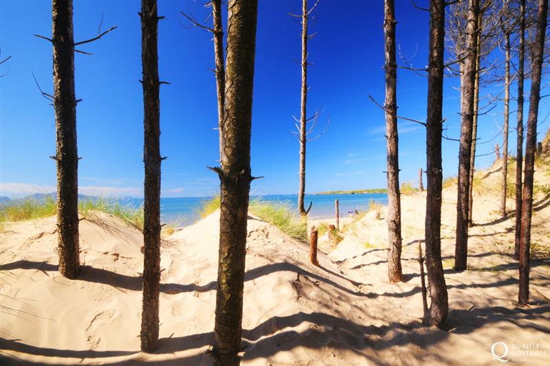Newborough beach fringed with forest. The long stretch of sandy beach leads to Llanddwyn island at Gelli Gron 4 bed, Criccieth