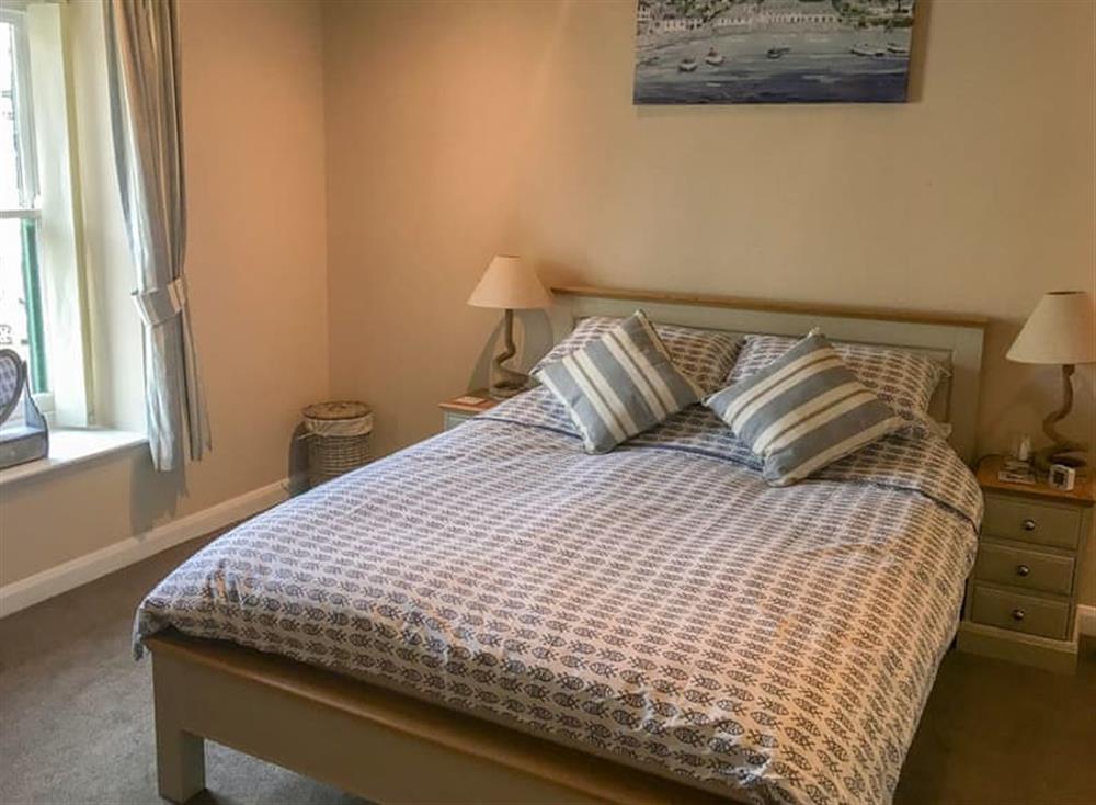 Cosy and welcoming double bedroom with high ceilings at Gemstone Cottage in Brixham, Devon